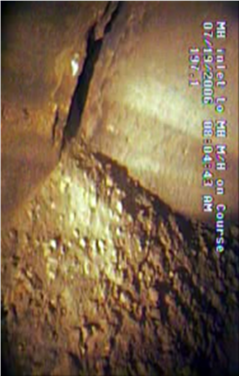 Separated joint (flaw) of reinforced concrete pipe.